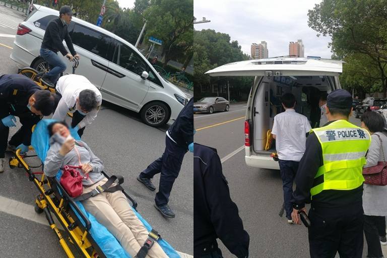惊心30秒！上海街头骑车女子不慎被卷入车底，警民合力抬车救人